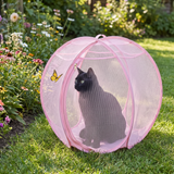 SpinnyMew pink cat playpen in the garden